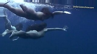 nudists showering in waterfall