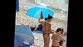 horny girl sunbathing on the beach