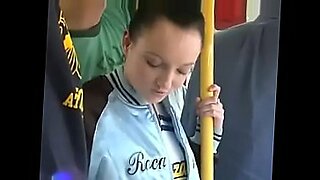 beside girl in bus