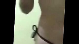 erect penis being led on a leash in public